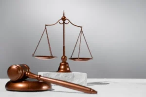 A gavel and a weighing scale of justice