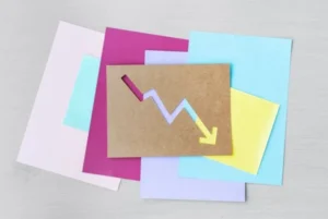 Colorful paper with downward arrow