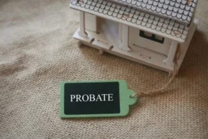 A house with a probate tag attached.