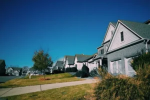 A residential subdivision featuring houses in white and gray colors