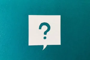 A square dialog box with a question mark, set against a blue-green background.